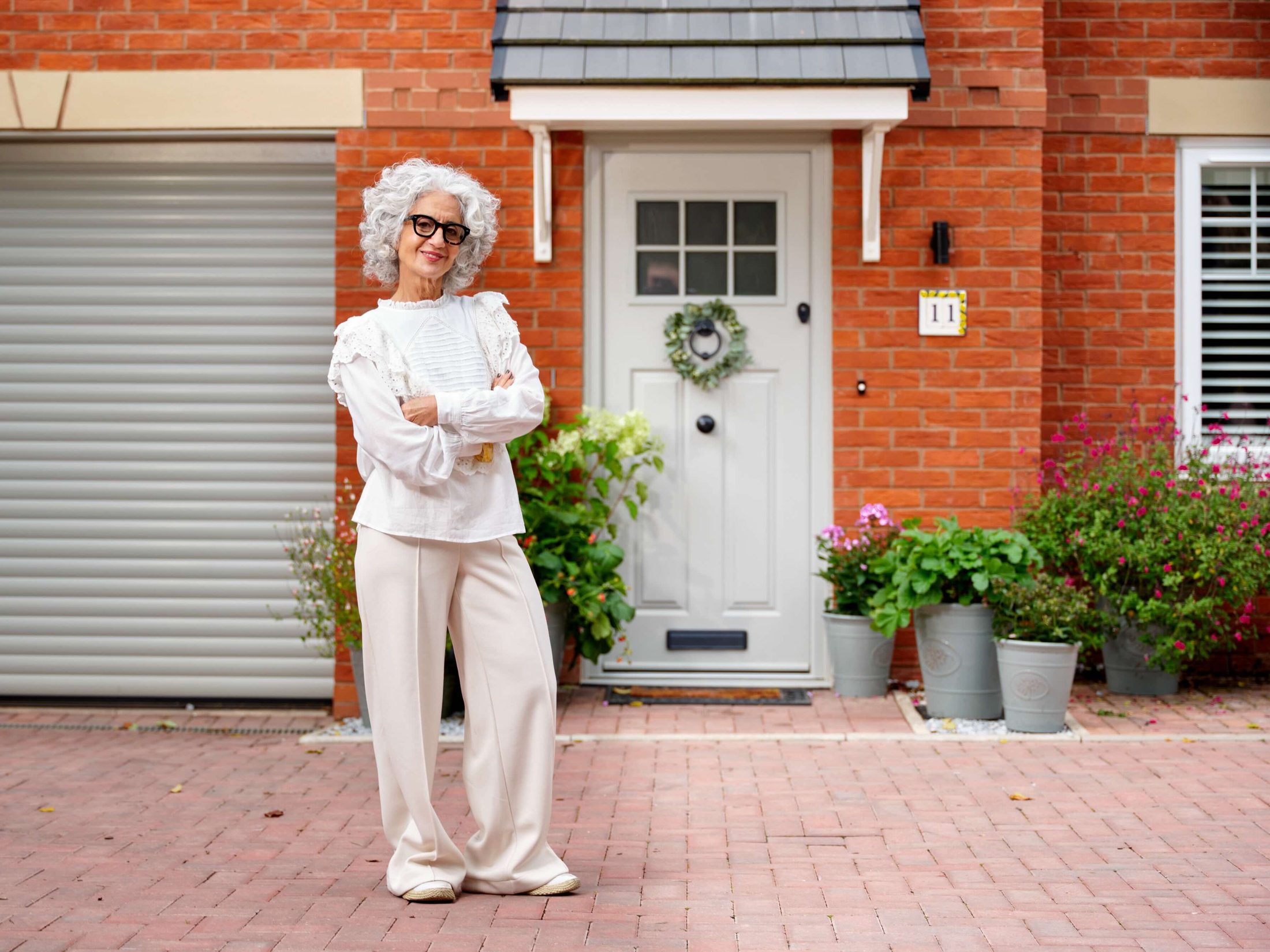 Endurance Doors — homeowner outside front door