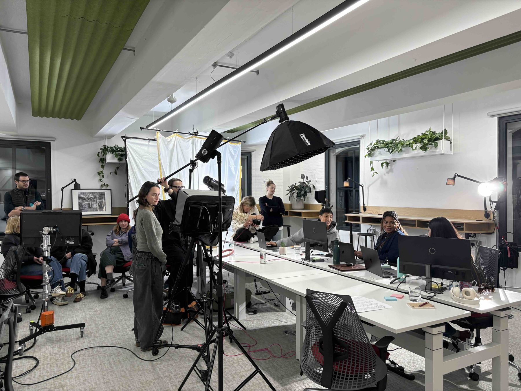 Crew and cast on set in the office environment