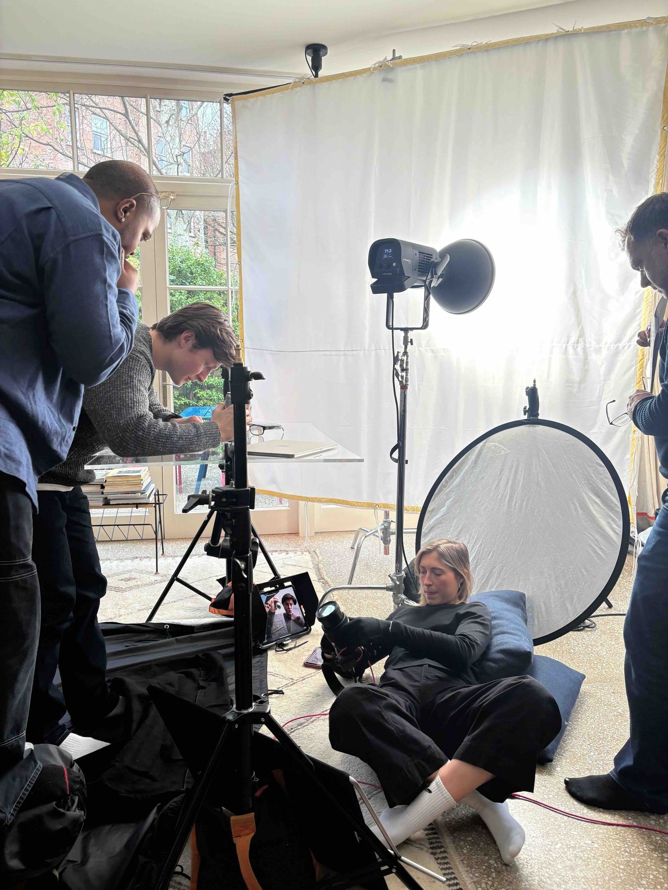 Crew setting up a studio portrait shoot