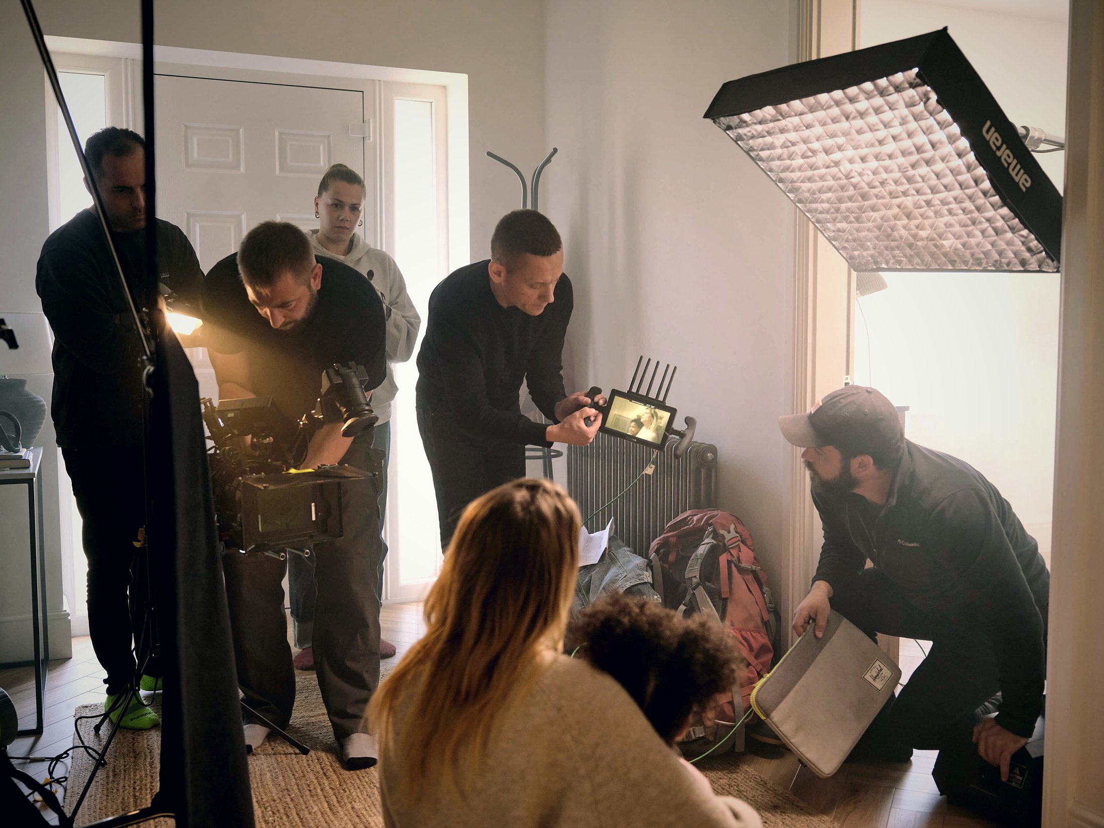 ottowilf crew on set reviewing a shot